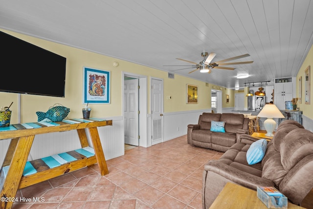 living room featuring ceiling fan, light tile patterned flooring, and wood ceiling