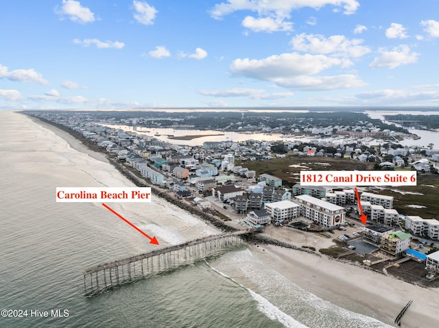 bird's eye view with a view of the beach and a water view