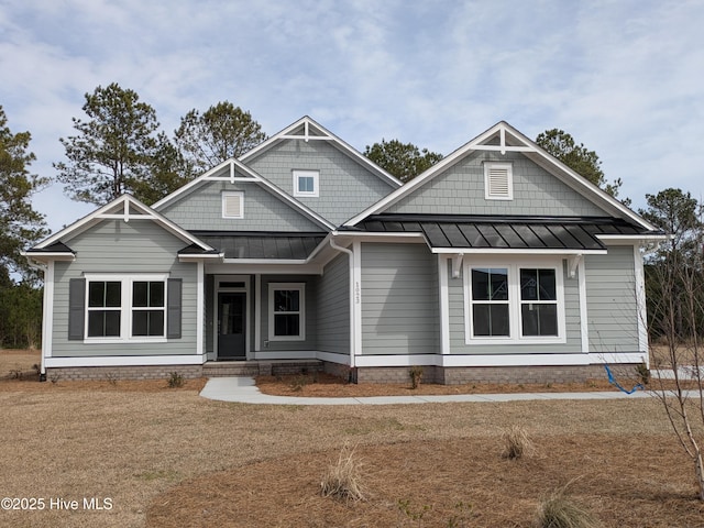 craftsman house with a standing seam roof and metal roof