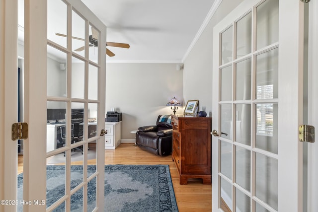 office area featuring ceiling fan, ornamental molding, french doors, and light wood-type flooring