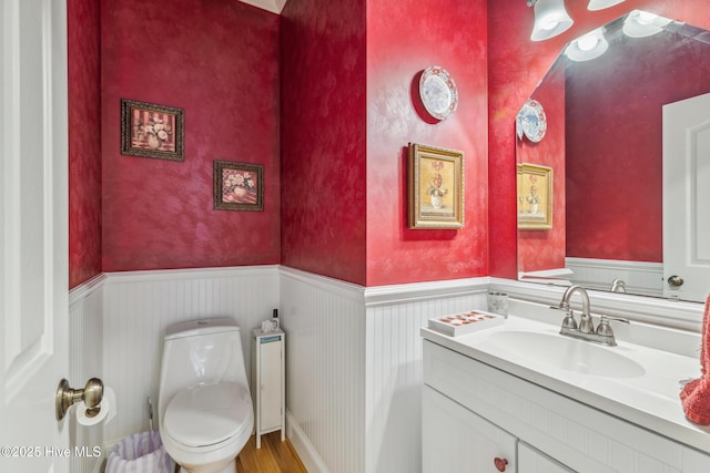 bathroom with toilet and vanity