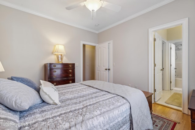 bedroom with ceiling fan, light hardwood / wood-style flooring, ensuite bath, and ornamental molding