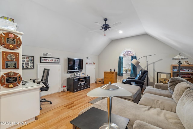 living room with vaulted ceiling, ceiling fan, and wood-type flooring