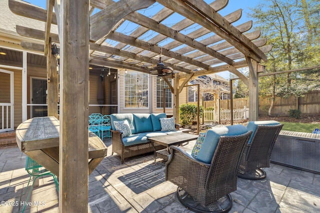 view of patio with ceiling fan, an outdoor living space, and a pergola