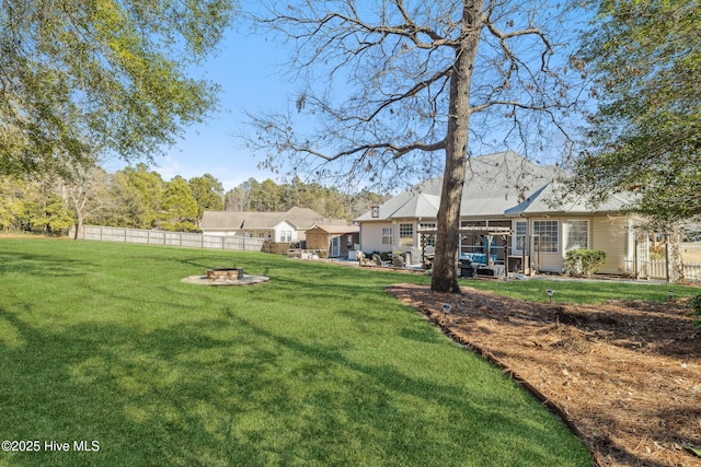 view of yard featuring an outdoor fire pit