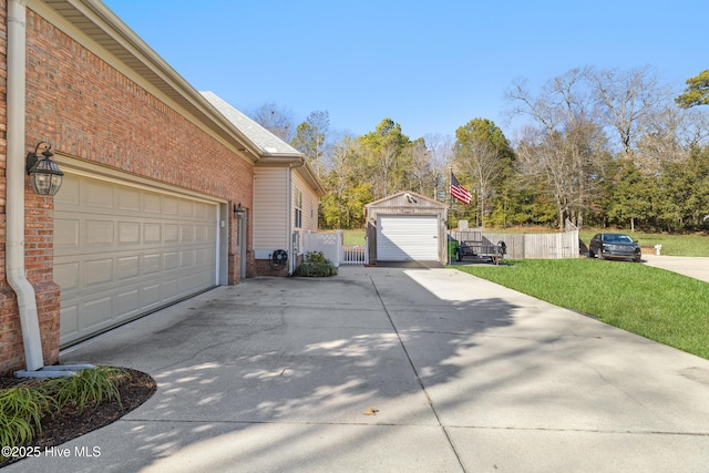 garage featuring a lawn