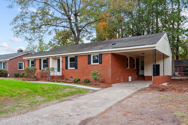 ranch-style home featuring a carport