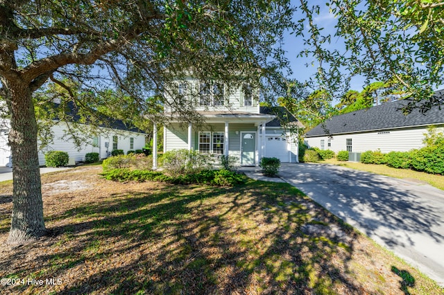 view of front of home featuring a porch and a garage