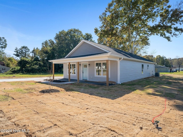 view of front of house with central air condition unit and covered porch