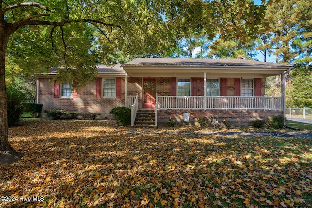 single story home with covered porch