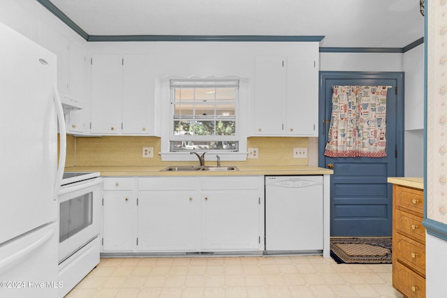 kitchen with white cabinetry, white appliances, and sink