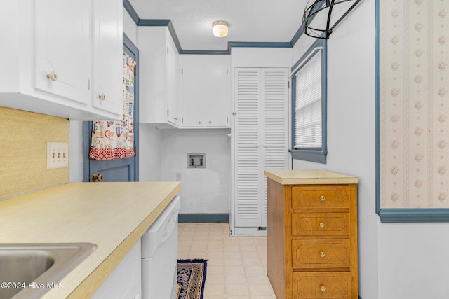 kitchen featuring white cabinetry, a textured ceiling, white dishwasher, and crown molding