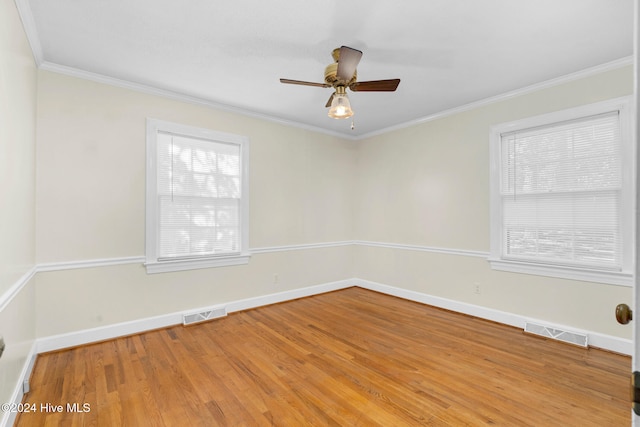 spare room featuring ceiling fan, hardwood / wood-style flooring, and ornamental molding