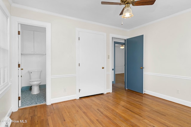 unfurnished bedroom with light wood-type flooring, ceiling fan, crown molding, and connected bathroom