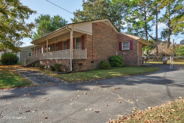 view of property exterior with a porch