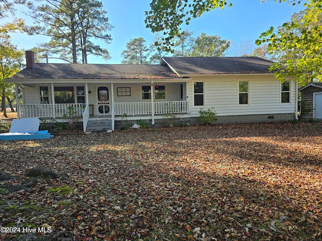 ranch-style house with covered porch