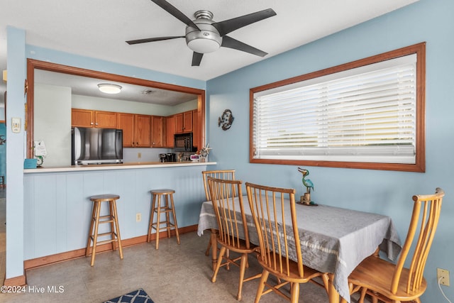 dining space featuring ceiling fan