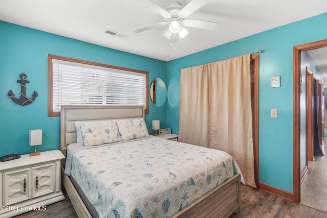 bedroom featuring dark wood-type flooring and ceiling fan