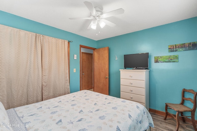 bedroom featuring hardwood / wood-style flooring and ceiling fan