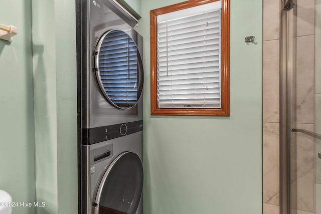 laundry room featuring stacked washer / dryer