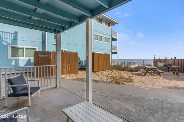 view of patio featuring a water view