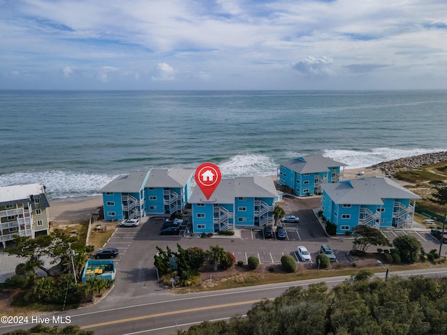 bird's eye view featuring a view of the beach and a water view