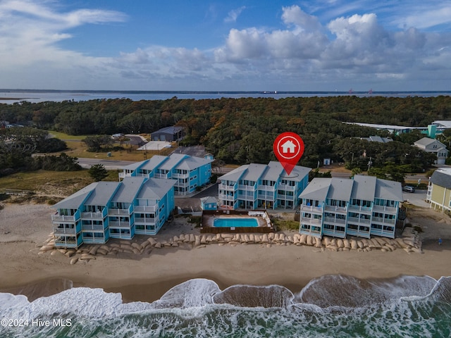 bird's eye view featuring a beach view and a water view