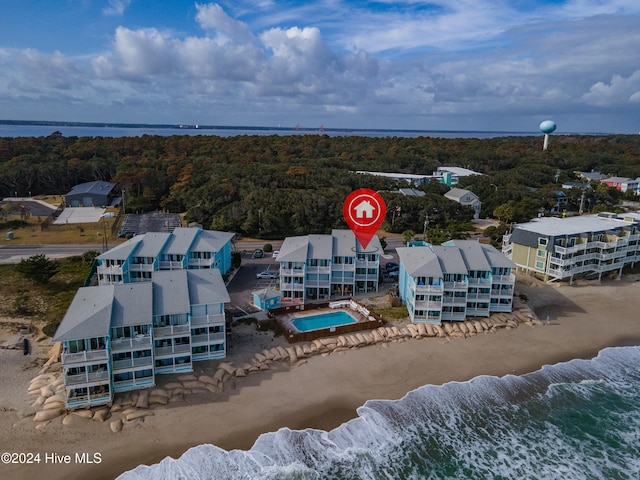 aerial view with a view of the beach and a water view