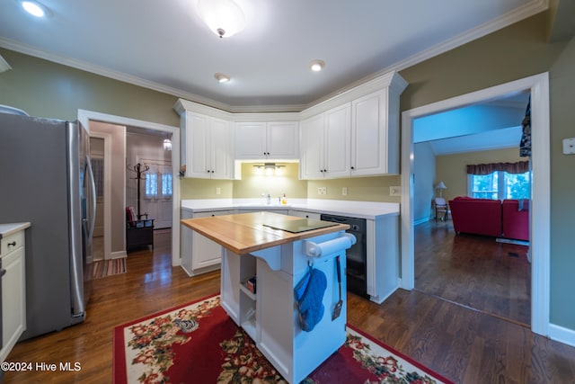 kitchen featuring wood counters, stainless steel fridge, ornamental molding, dark hardwood / wood-style flooring, and white cabinetry