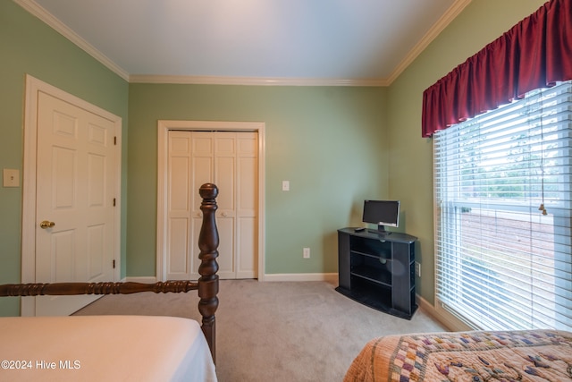 bedroom with light carpet, a closet, and crown molding