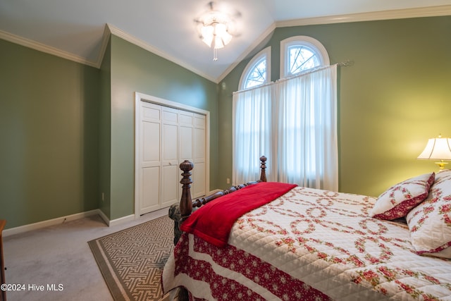 carpeted bedroom with crown molding, a closet, and lofted ceiling