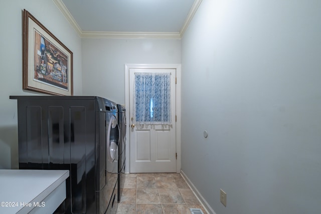 washroom featuring separate washer and dryer and crown molding