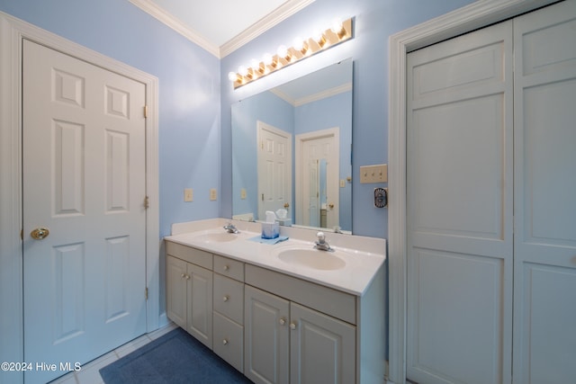 bathroom with tile patterned flooring, vanity, and crown molding