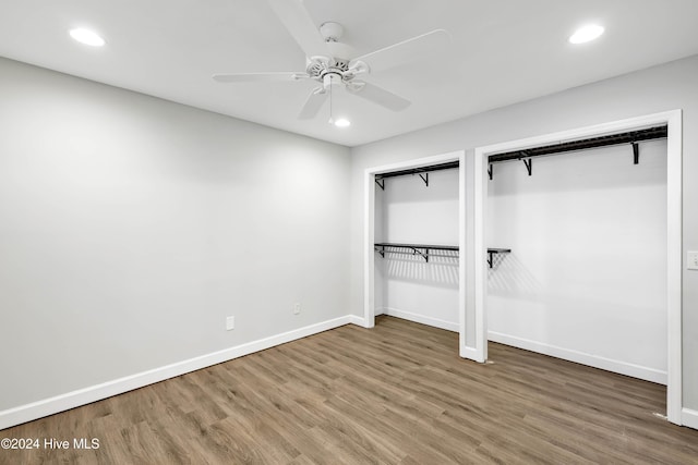 unfurnished bedroom featuring wood-type flooring and ceiling fan