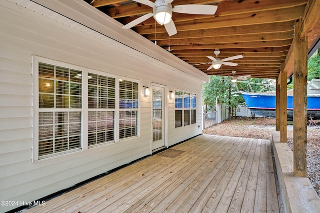 wooden deck featuring ceiling fan