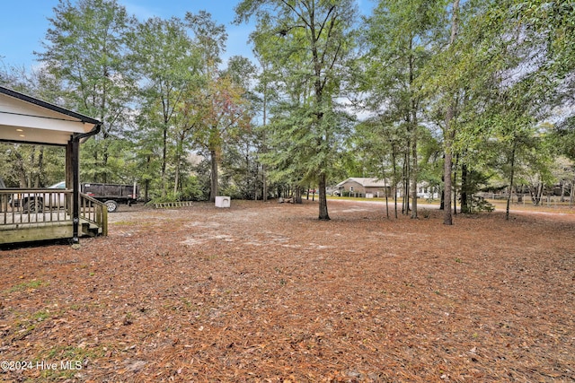 view of yard with a deck