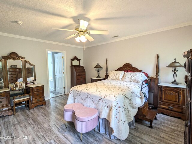 117 Longwood Dr, Stella, NC 28582 - bedroom featuring wood finished floors, ornamental molding, ceiling fan, baseboards, and connected bathroom