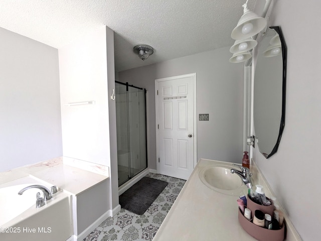 117 Longwood Dr, Stella, NC 28582 - full bathroom featuring a shower stall, a textured ceiling, a garden tub, tile patterned floors, and vanity