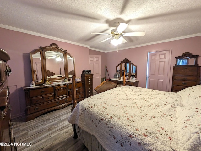 bedroom with hardwood / wood-style flooring, ceiling fan, a textured ceiling, and ornamental molding