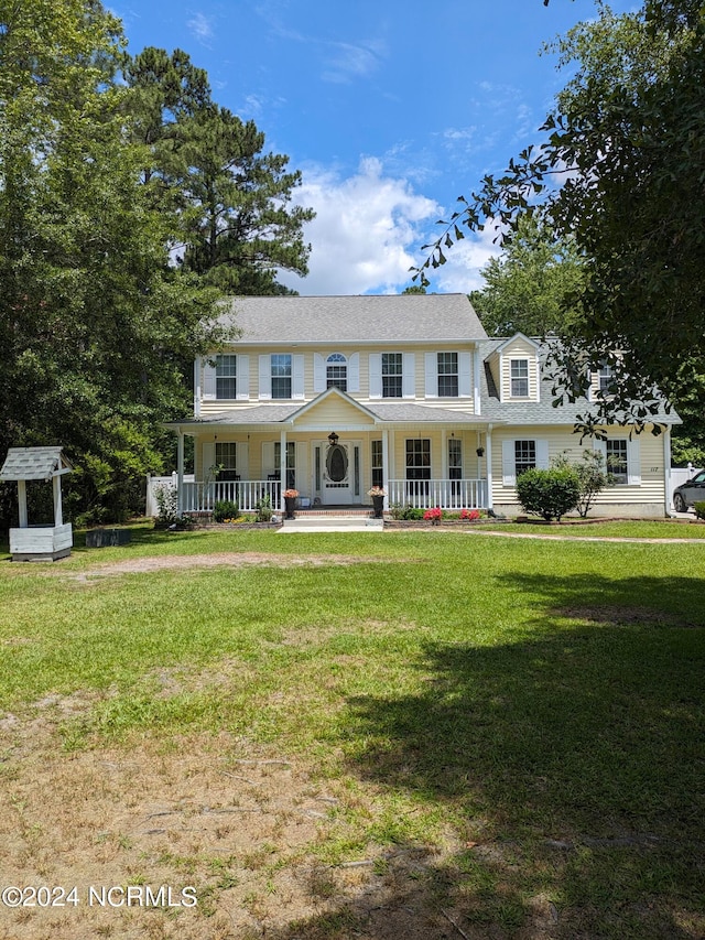 view of front of house featuring a front lawn and a porch