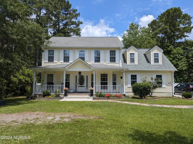 117 Longwood Dr, Stella, NC 28582 - colonial house featuring covered porch, a shingled roof, and a front yard