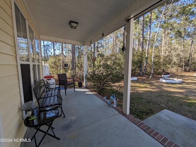 117 Longwood Dr, Stella, NC 28582 - view of patio / terrace with a porch