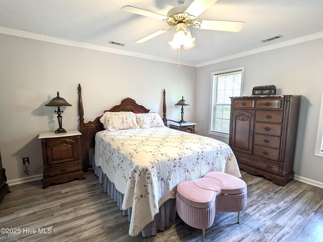 117 Longwood Dr, Stella, NC 28582 - bedroom with wood finished floors, baseboards, crown molding, and ceiling fan