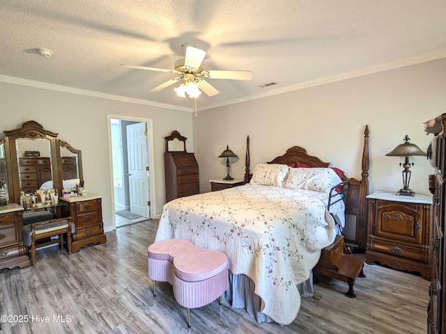 117 Longwood Dr, Stella, NC 28582 - bedroom featuring wood finished floors, ornamental molding, ceiling fan, baseboards, and connected bathroom