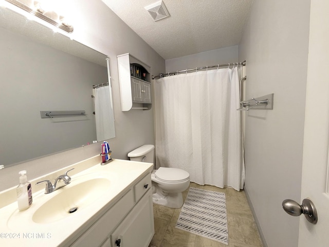 117 Longwood Dr, Stella, NC 28582 - full bathroom with a textured ceiling, vanity, toilet, and a shower with shower curtain