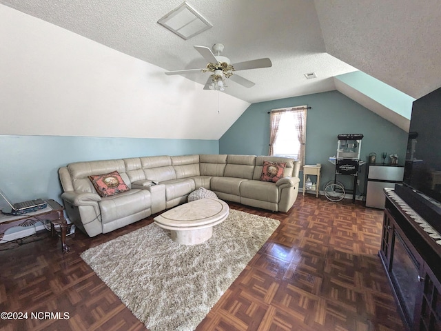 117 Longwood Dr, Stella, NC 28582 - living room with lofted ceiling, ceiling fan, and a textured ceiling