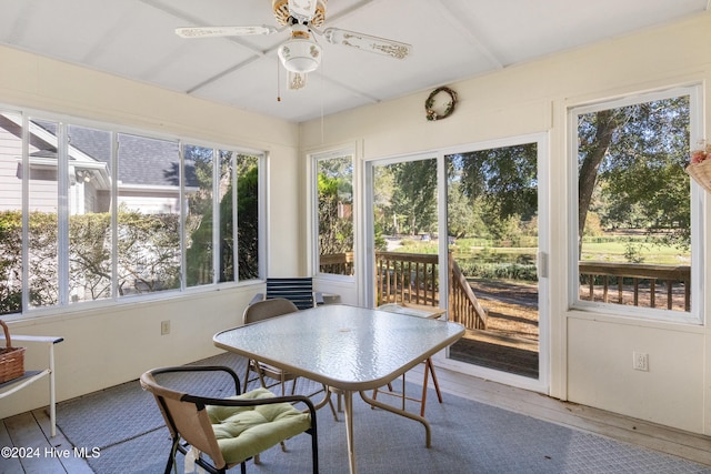 sunroom with ceiling fan and a healthy amount of sunlight