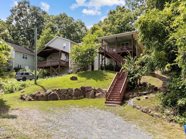 rear view of property with a lawn