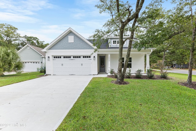 view of front facade featuring a front lawn and a garage