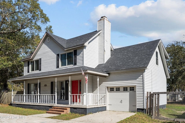 view of front of property featuring a porch and a garage